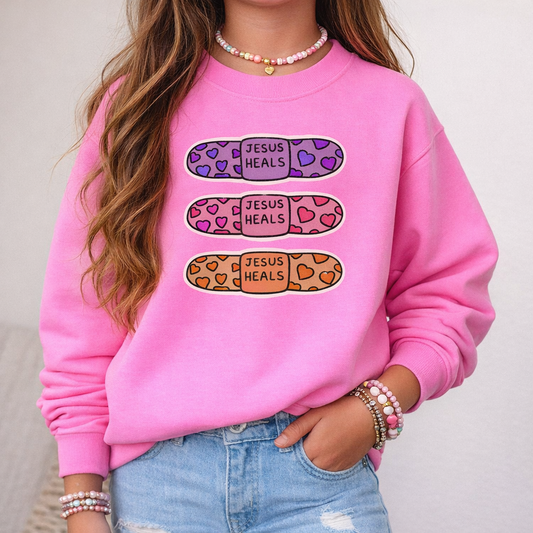 Youth Crewneck Sweatshirt - 'Jesus Heals' Colorful Leopard Bandage Graphic